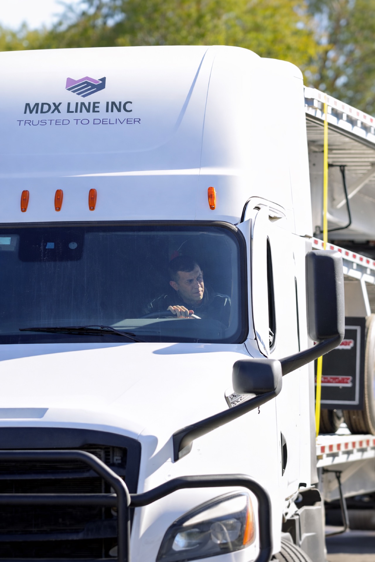 MDX Line Freightliner with driver and company branding